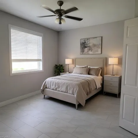 Bedroom featuring a ceiling fan and light tile patterned floors