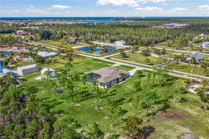 View of the home looking northwest - in the distance you will see the Class A new RV Park - why not have your own oasis and you can easily add on multiple RV garages and or car collection garages!