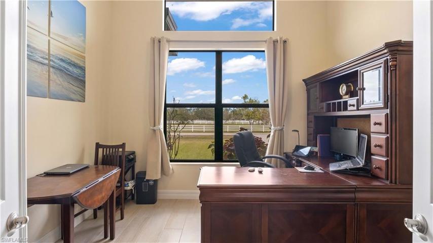 Large office space with STUNNING views outside!  Double door entry off the great room and can also be a flex room for home school, piano room etc.