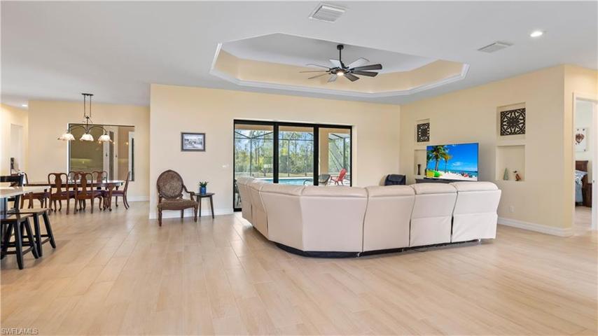 Triple sliders open to the outside and extend and blend the indoor and outdoor living spaces.  Great room has large walls to display your art collection, as well as art niches built in on the main wall.