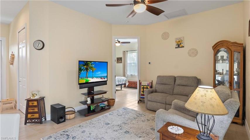 Large living area and so many walls to display your art / photos etc.  Wide door to guest home master bedroom which also features a very large closet that is also used as a craft room - very spacious and another flexible option!