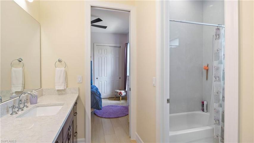 Jack and Jill bath is shared between the two guest bedrooms with a water closet for privacy.  There is also an additional half bath for guest to use off the foyer area!  Perfect set up for two children as well!