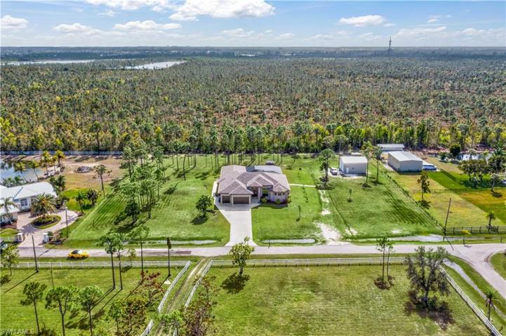 A wider aerial view of the property - Owner was the Builder and great care was taken in the building process - so many upgrades and attention to detail.  The ARTESIAN well is 298 feet deep - direct into the aquifer for the most amazing water.  The whole house has reverse osmosis and there is a 500 gal  holding tank with aerator and ½ hp house pump