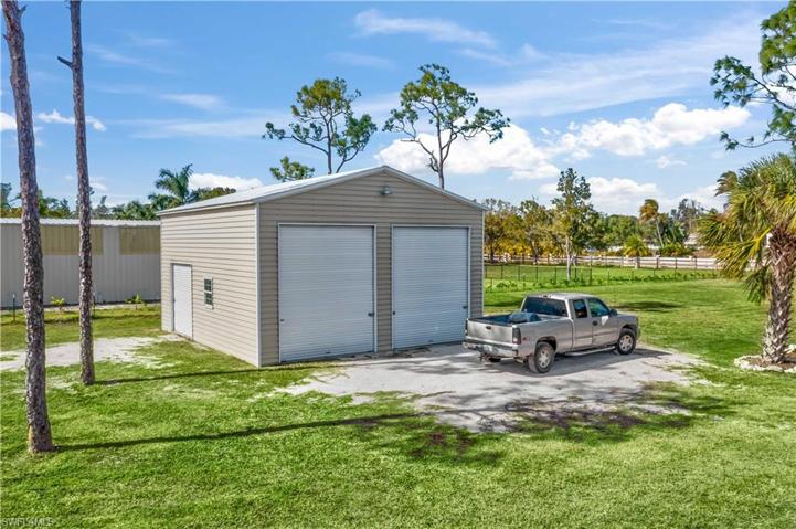 The perfect addition to this already perfect home!  •26'x30'x 16' Detached metal building (150 mph rating).  This can easily accomodate multiple car lifts, or can be used for so many different uses!  The way this home sits on the lot, and there not being a pond, the new owner can bring their vision to life whether it is adding stable, warehouse, additional pole barn - or leaving it just the way it is!  There are two 14 doot rollup doors on the front, and the side has a ten foot roll up door.