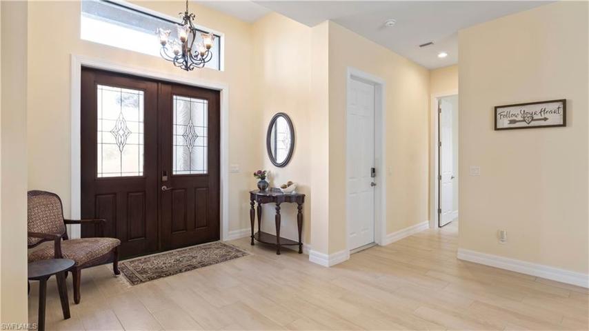 Beautiful double door entry into a wide open floor plan that is open, airy and customized in every direction!  All tile flooring throughout the home, neutral paint palette - clean, straight lines and lots of attention to details!