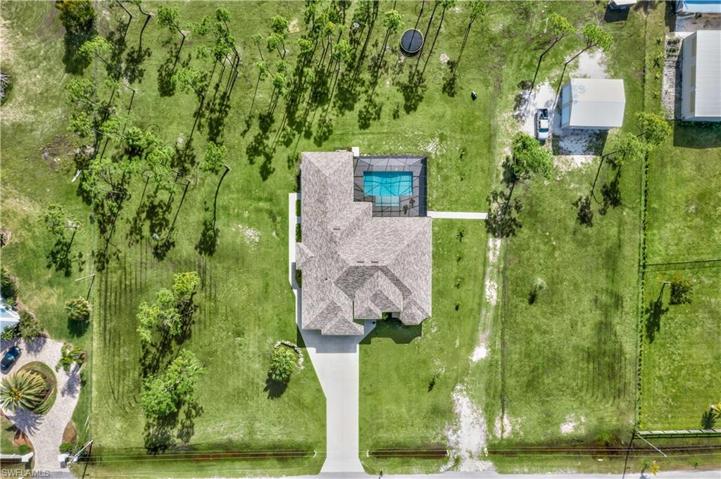 Aerial view of the home - two and a half acres of fabulousness!  AG-2 zoning allows for horses, rvs and businesses (verify business with county).  Unincorporated county land on a private road with all kinds of options!
