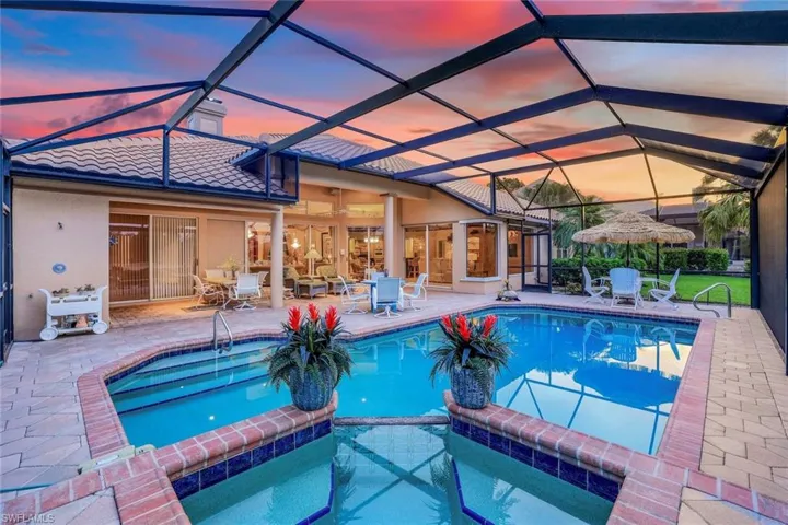 View of swimming pool with a pool with connected hot tub and a patio