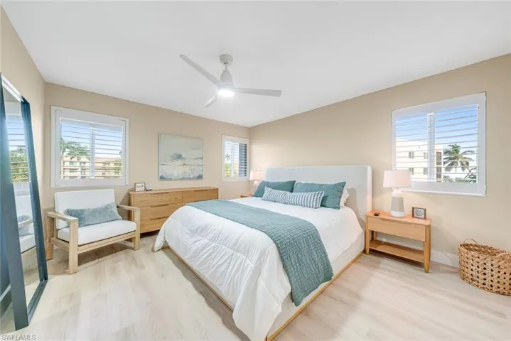Bedroom with light wood-type flooring and a ceiling fan