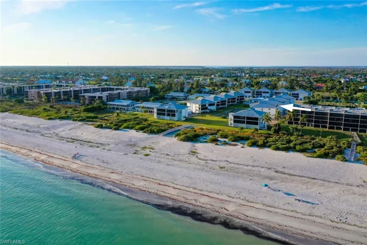 Aerial view of waterfront with a beach