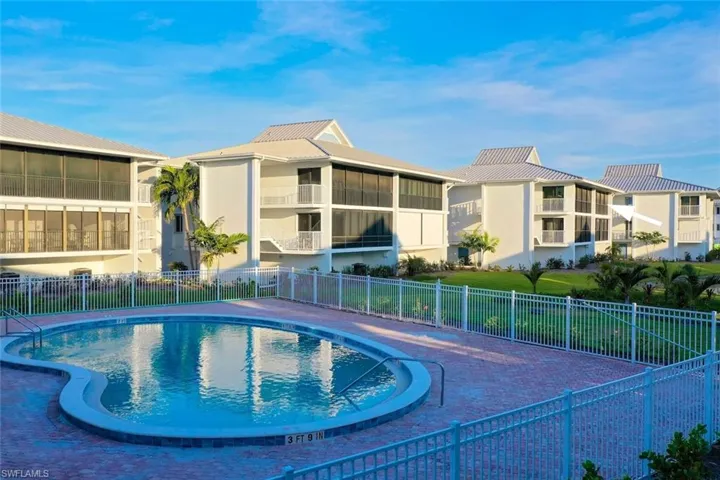 Community pool featuring a patio