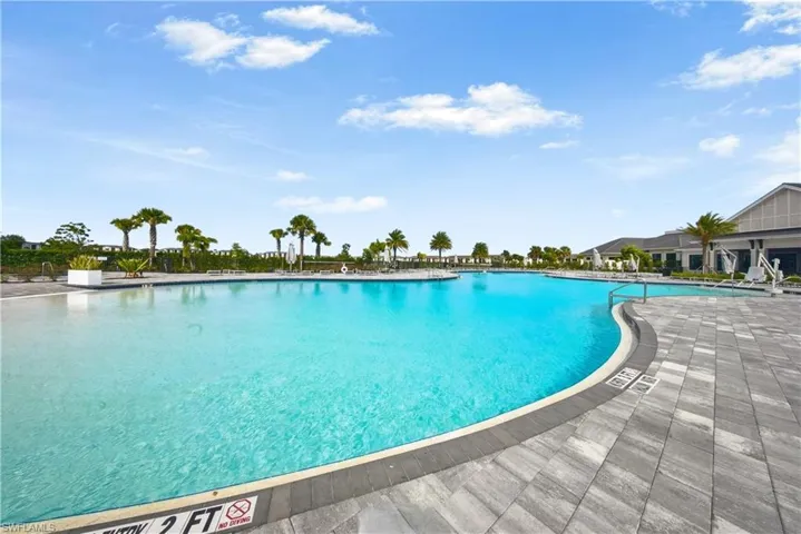Community pool featuring a patio area