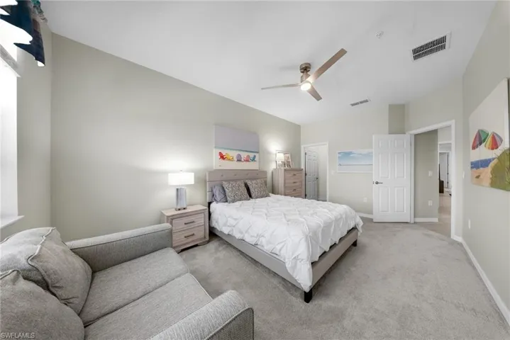 Bedroom with carpet and a ceiling fan