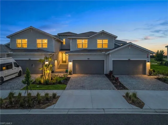 Traditional home with driveway and an attached garage