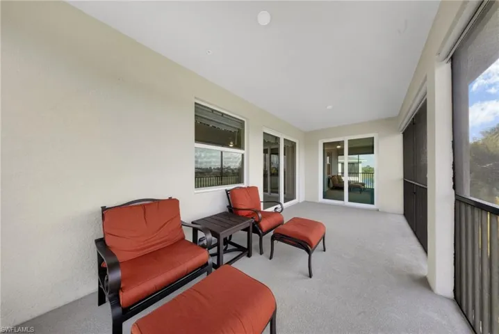 Sunroom featuring plenty of natural light and carpet floors