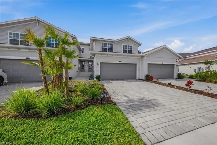Traditional-style home with driveway and an attached garage