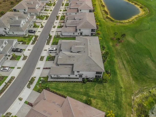 Aerial perspective of suburban area with a large body of water