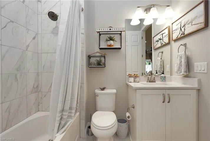 guest bath that has dual entry from kitchen and guest room