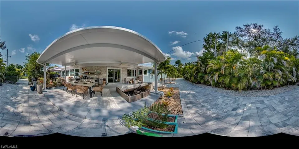 View Backyard with Outdoor Kitchen