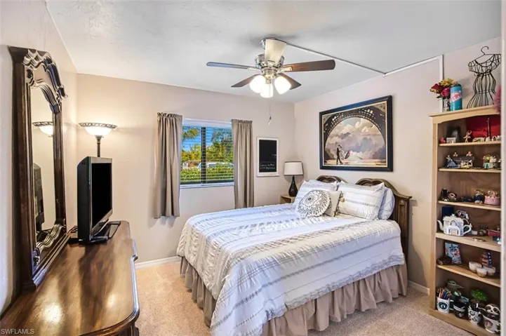 Bedroom featuring carpet floors and ceiling fan