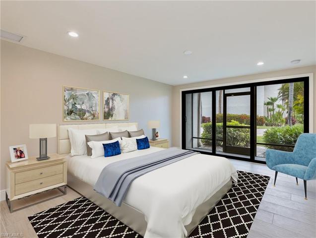 Rear guest bedroom and porch; faces community pool area and water feature