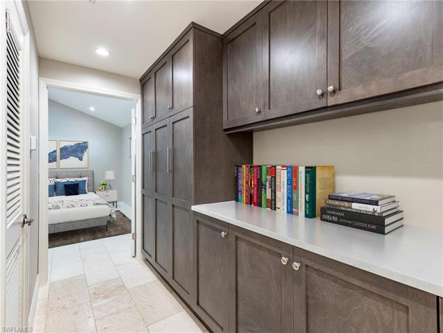 Custom cabinetry in second floor primary suite hallway; entry to primary bedroom