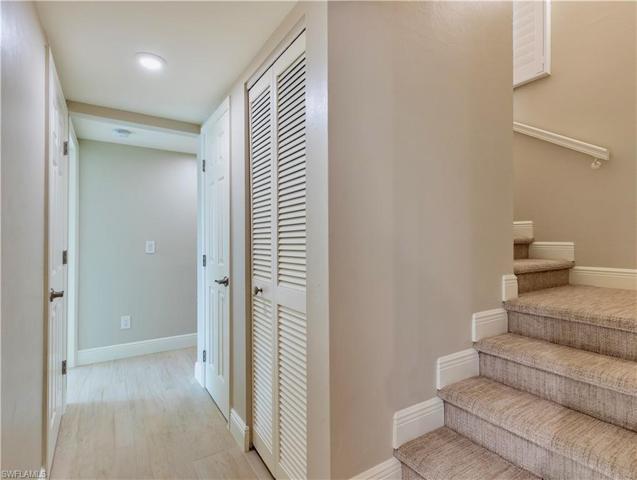 Downstairs hall to bedrooms, baths, and stairwell