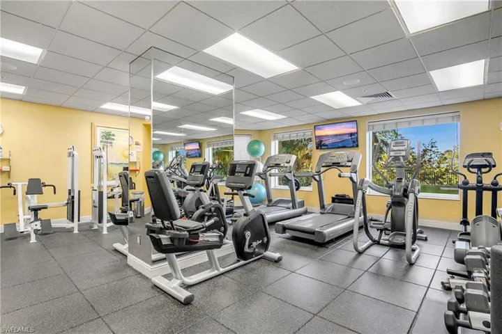 Gym with a paneled ceiling