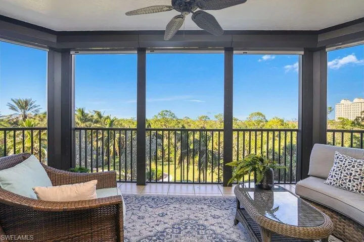 Sunroom / solarium featuring ceiling fan and plenty of natural light