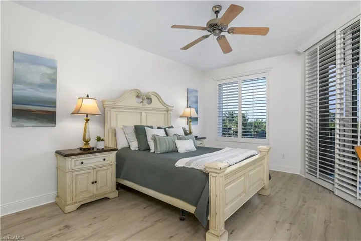 Bedroom featuring ceiling fan and light hardwood / wood-style floors