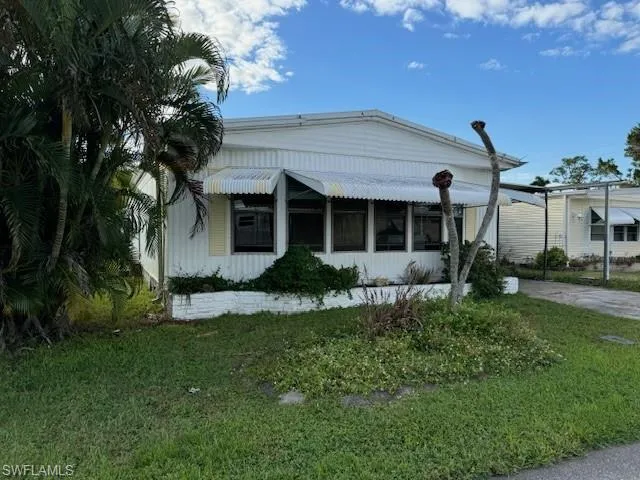 View of front of property with a front yard