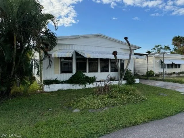 View of front of home featuring a front lawn