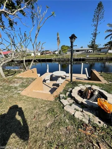 Deck with seawall and seating area to enjoy the sunsets, fishing, kayaking , boating or just a relaxing day.