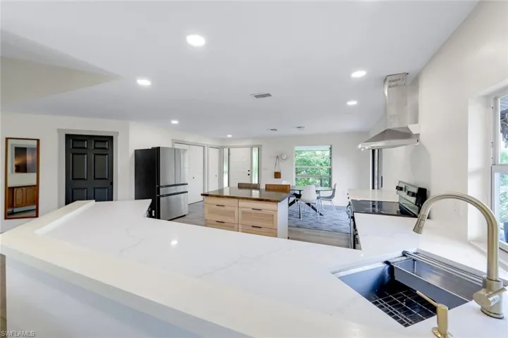 Recently updated spacious kitchen with NEW quartz counter tops & stainless steel appliances.