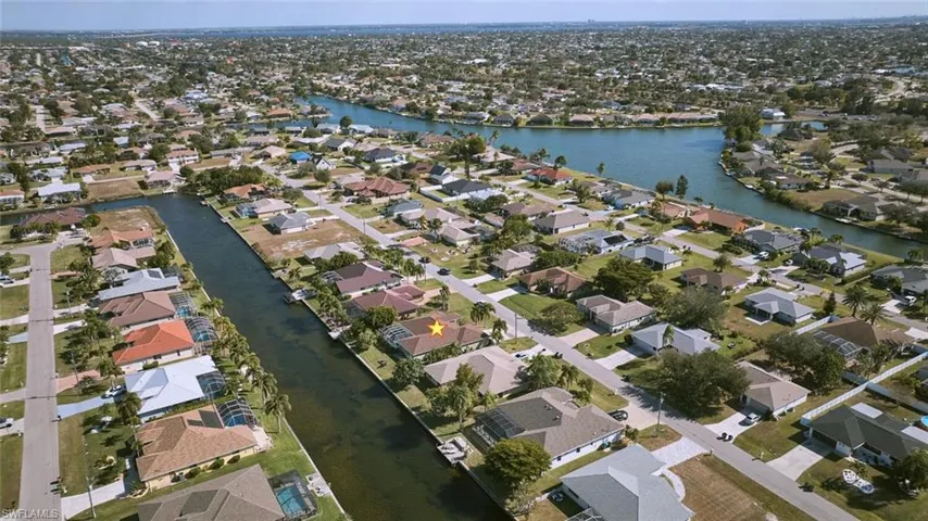 Nice aerial view of the home showing the fresh water canal system in Cape Coral.  Boat for miles and miles!