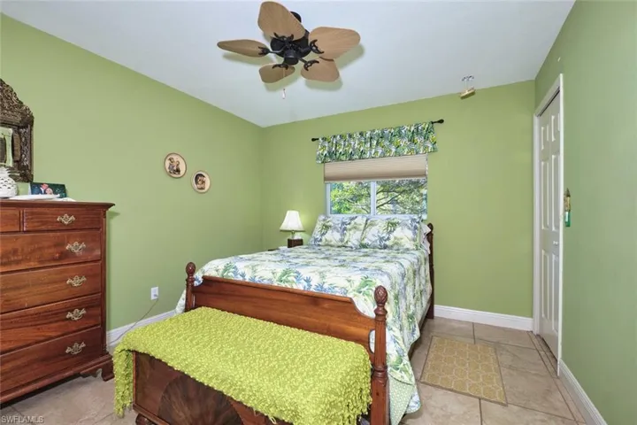 One of three guest rooms with a nice size closet.  Tile Flooring.  Full size bed.  Very comfortable room.  Can also be used as an office, artist studio, home gym...