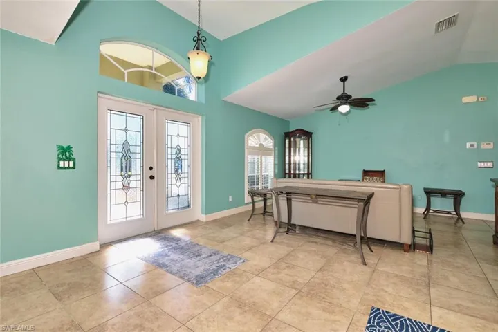 Nice entryway, High ceilings and plant shelves.  Very large area.  Stained glass double doors.