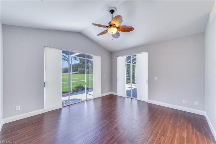 Primary bedroom with multiple sliders to lanai access.