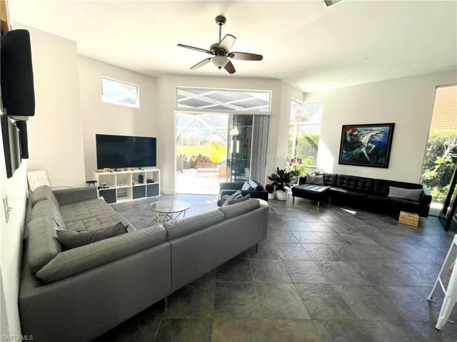 Current view of living room with white painted walls.