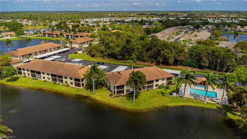 Aerial of the back of condo and nearby pool