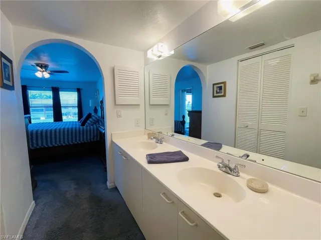 Full bath with ensuite bathroom, double vanity, a closet