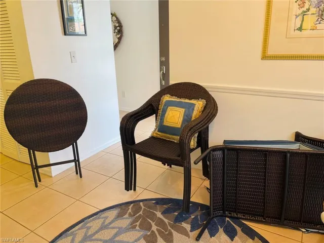 Bistro table, 4 chairs and lounge chair typically set up on the lanai. The table and chairs could be used in this flex space if you wanted extra interior dining option