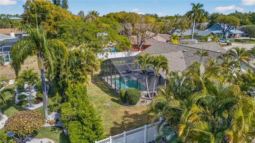 Aerial perspective of suburban area with a pool