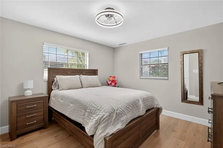 Bedroom featuring baseboards and light wood-style flooring