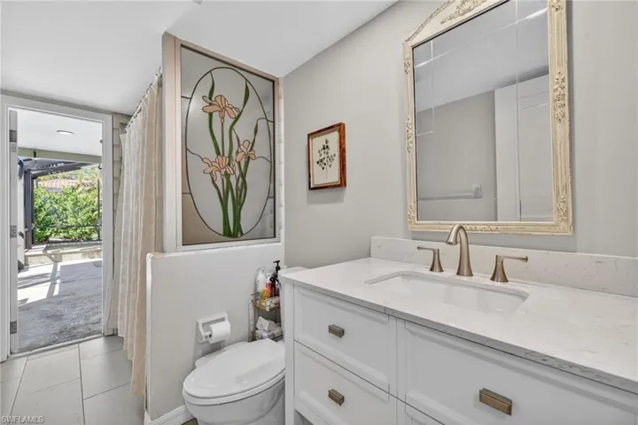 Full bath featuring vanity and toilet