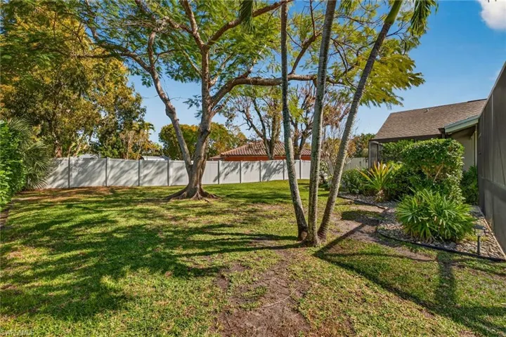 View of fenced backyard