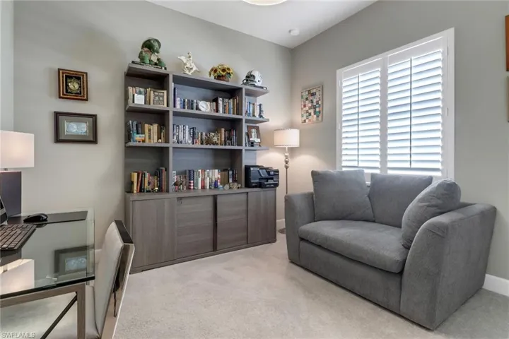 Living area with light colored carpet
