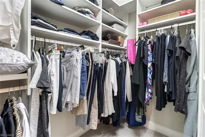 Walk in closet featuring carpet