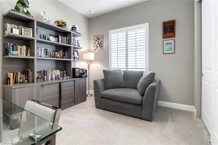 Sitting room with light colored carpet