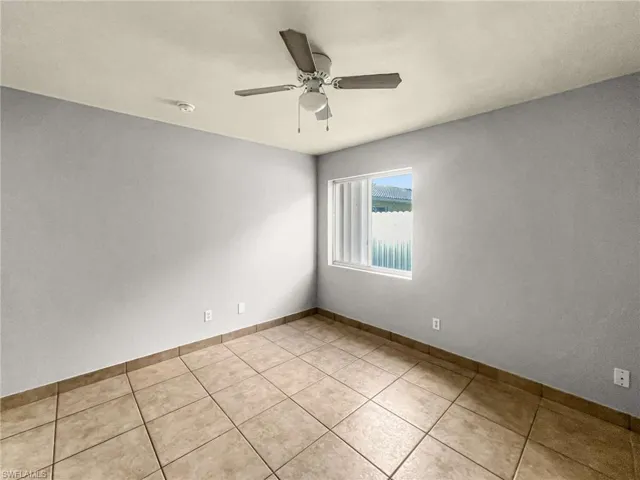 Neutral-toned tile flooring throughout
