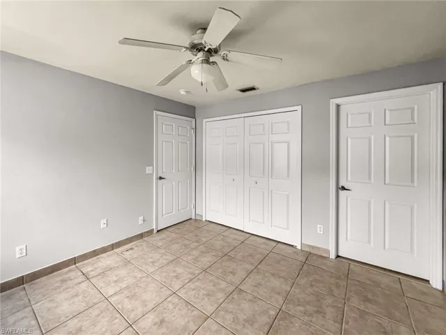 Neutral gray walls with tile flooring